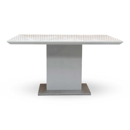 Front view of the Grigio dining table, showcasing the elegant grey and white marble patterns on the ceramic surface.