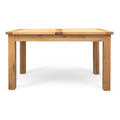 Front view of the Furniture land 'Augusta' solid oak extending dining table, showcasing its modern country style and natural wood grain.