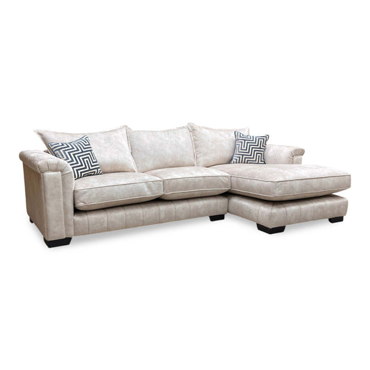 Full view of the cream Dolcie chaise sofa, showcasing the structured formal back design and spacious seating area.