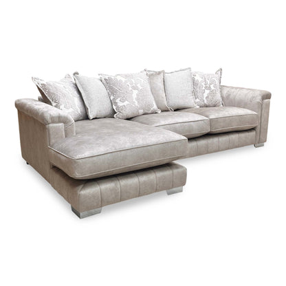 Side profile of the sofa, emphasizing the deep seating and the extended chaise section designed for lounging.