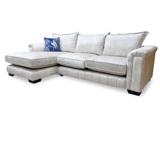 Full view of the DFS 'Dolcie' cream chaise sofa in its left-hand facing configuration, highlighting the clean lines of the formal back design.