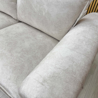 Close-up of the left-hand facing chaise extension, demonstrating the generous lounging area and integrated comfort of the design.