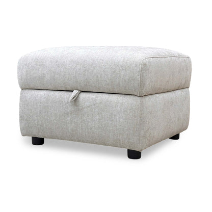 Side view of the Hetty footstool with the lid open, revealing the spacious black-lined interior storage for blankets, pillows, or living room essentials.