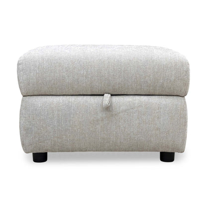 Front profile of the footstool, emphasizing the compact footprint and the practical height for use as a footrest or extra seat.