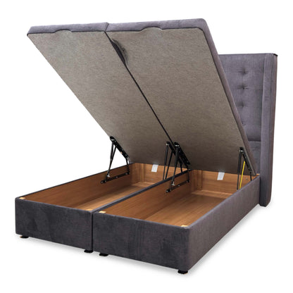 View of the manual end-lift ottoman base in the open position, demonstrating the spacious under-bed storage area.