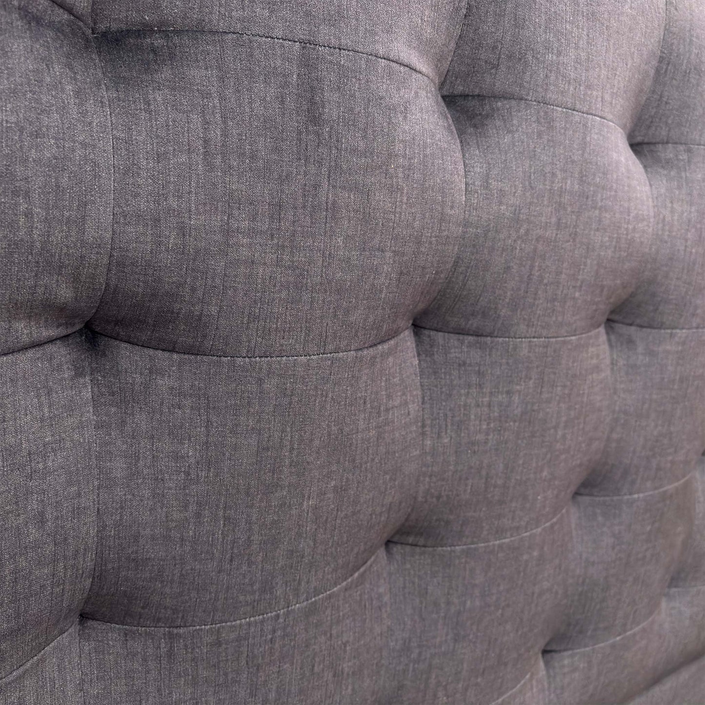 Close-up of the Smokey Quartz fabric, showing the high-quality woven texture and detailed button tufting on the headboard.