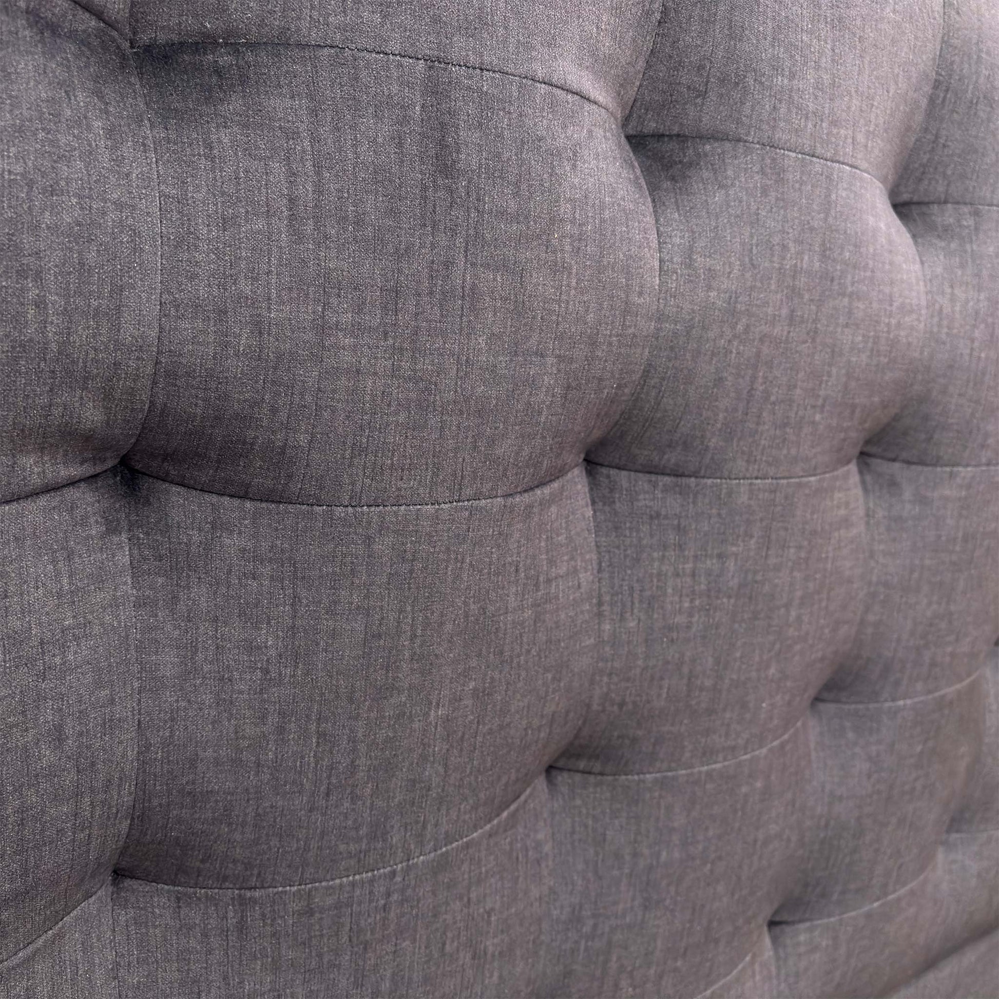 Close-up of the Smokey Quartz fabric, showing the high-quality woven texture and detailed button tufting on the headboard.