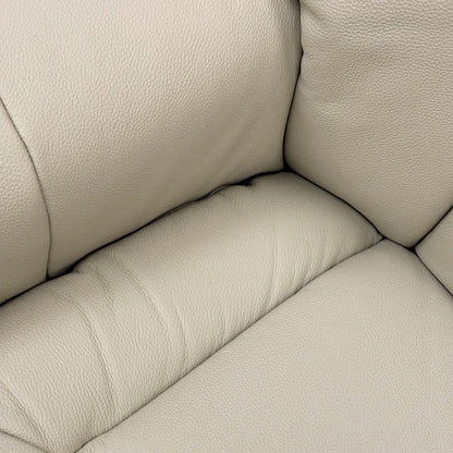 Close-up of the Mushroom leather upholstery, highlighting the fine grain texture and the quality of the top-stitch detailing.