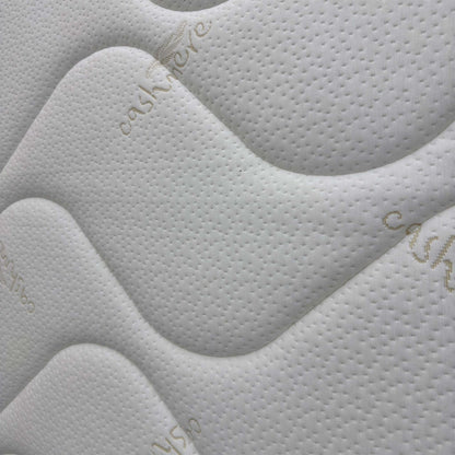 Close-up of the breathable top fabric and tufted detailing, highlighting the soft-to-the-touch texture and cooling weave.