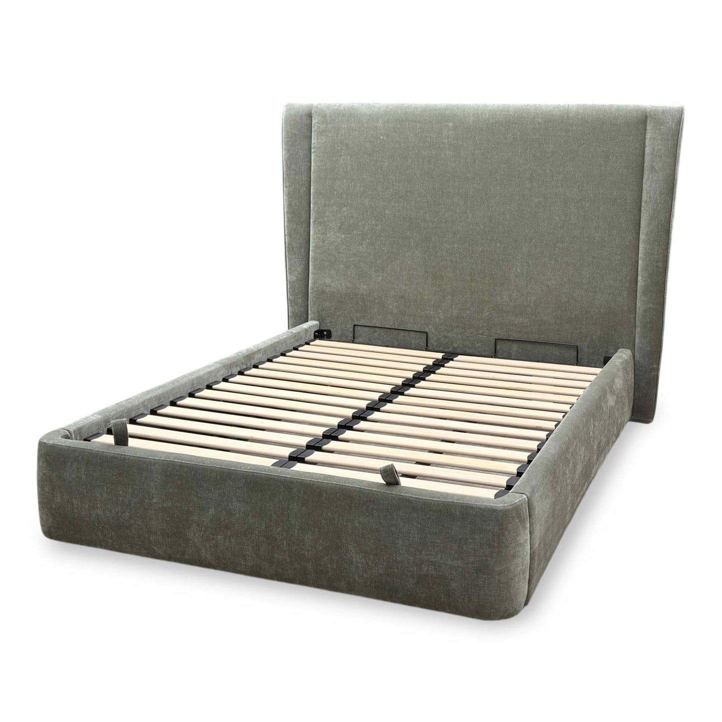 Side view the ‘Dior’ Forest Green End Ottoman Bed Frame, showing the smooth, effortless operation of the gas-lift hydraulics, frame sturdiness, and rich fabric texture.