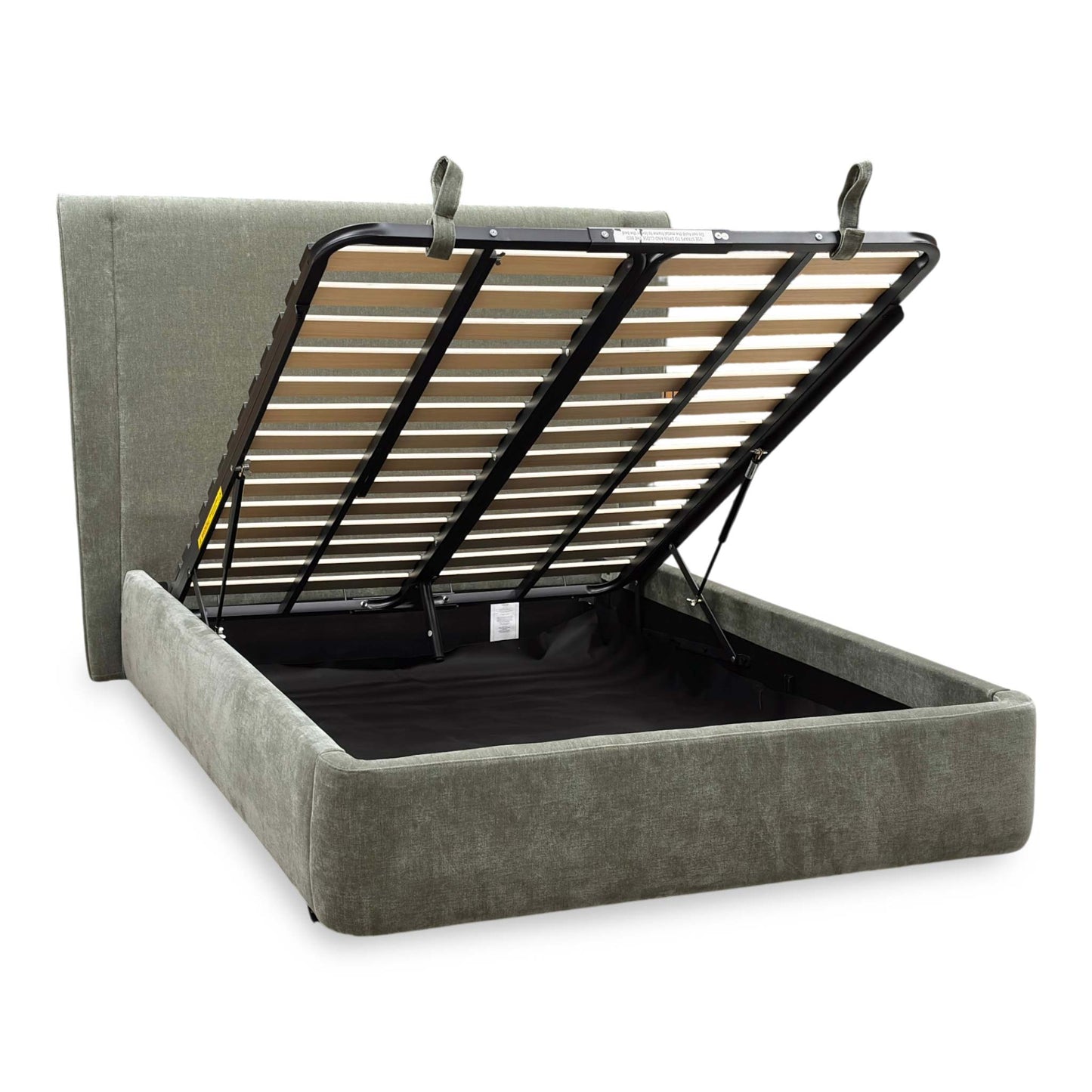 Side view of the ‘Dior’ bed frame with the mattress platform fully raised from the foot end, demonstrating the expansive, clean storage area and heavy-duty lift mechanism.