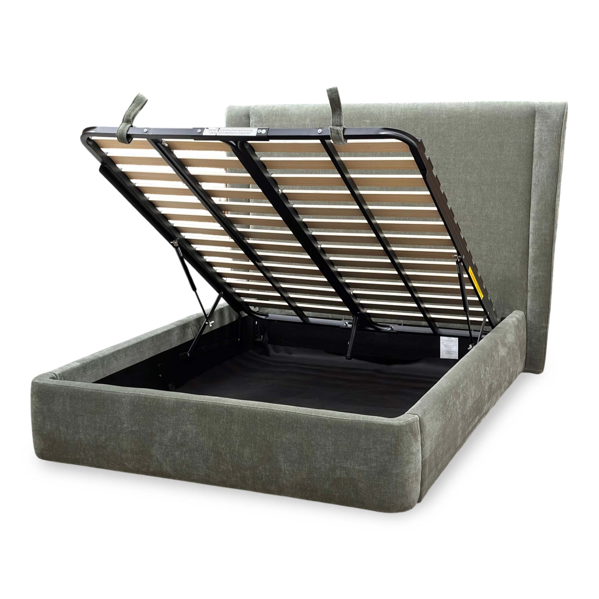Side profile of the ‘Dior’ ottoman bed, highlighting the majestic height and plush padding of the winged headboard, low-profile footboard, and solid floor-hugging base.
