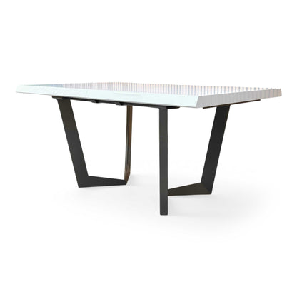 Side profile of the Palazzo table, emphasizing the clean, minimalist lines and the reflective quality of the white lacquer finish.