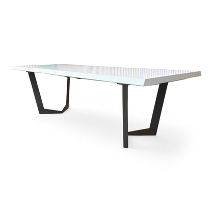 Side profile of the Palazzo table, emphasizing the clean, minimalist lines and the reflective quality of the white lacquer finish.