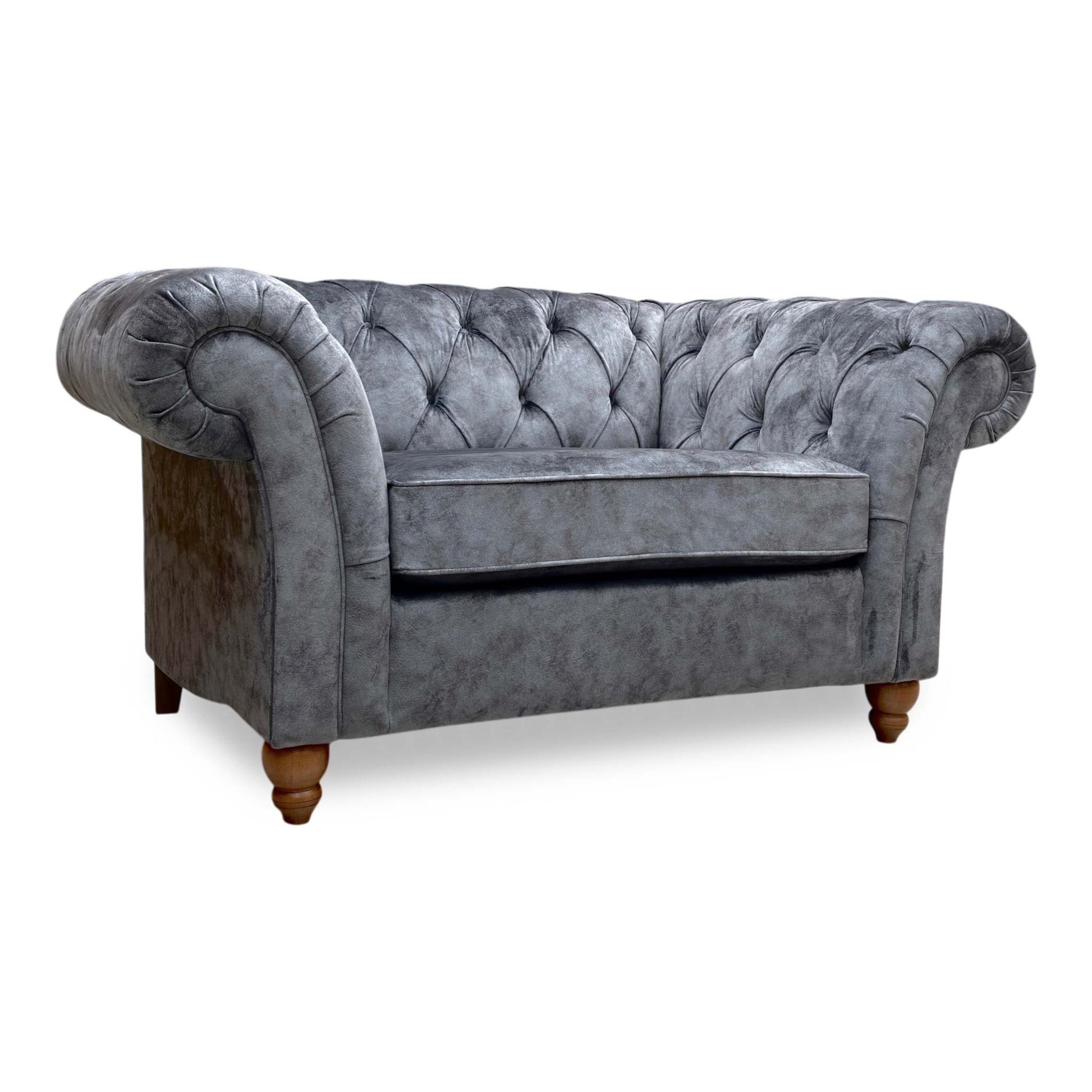 Full view of the Gosford Snuggler Chair in Charcoal Grey velvet, featuring classic scroll arms and a deep, plush seat cushion.