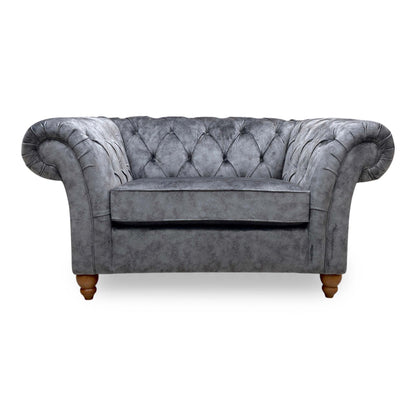 Front view of the Gosford Charcoal Grey Snuggler Chair, demonstrating the cushion loft, fabric texture, and classic wooden feet.