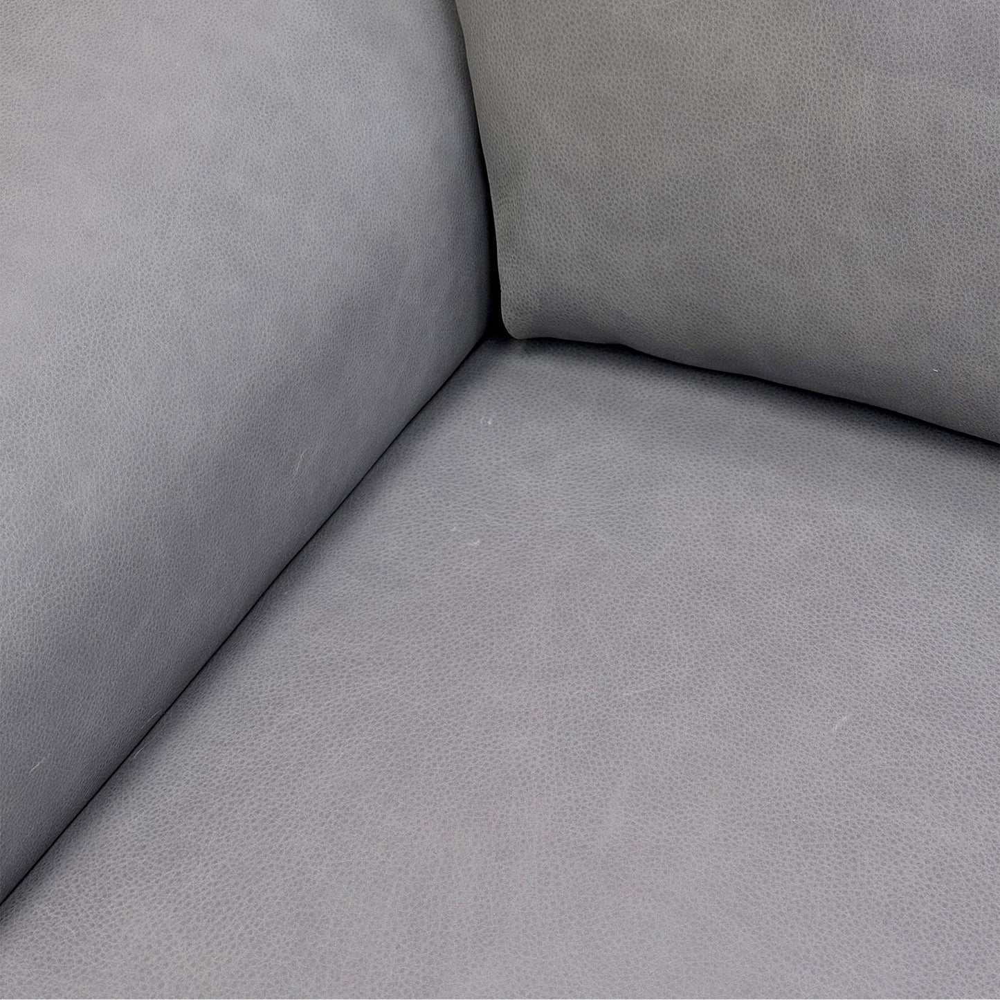 Close-up of the power reclining footrest fully extended, illustrating the seamless transition and ergonomic leg support.