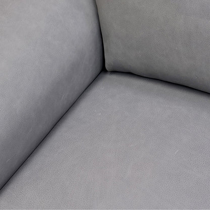 Close-up of the power reclining footrest fully extended, illustrating the seamless transition and ergonomic leg support.