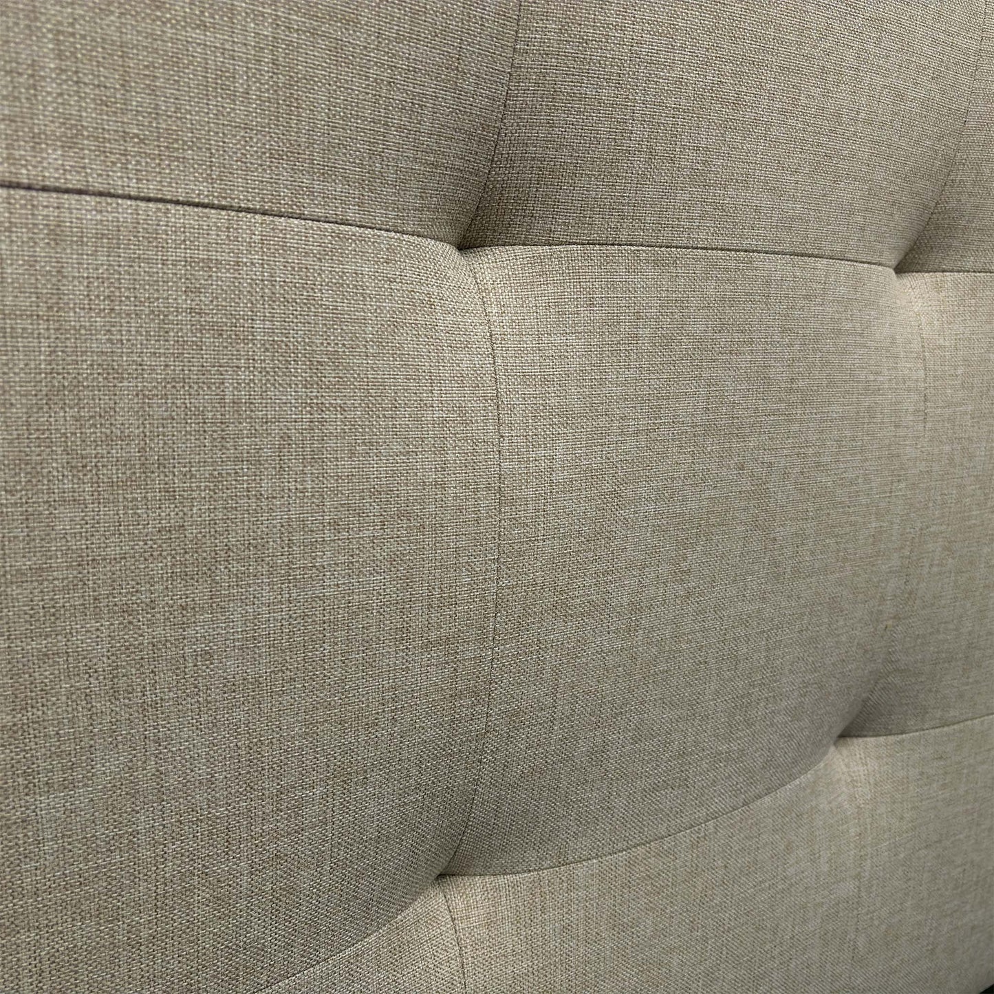 Close-up of the Oatmeal fabric, highlighting the soft woven texture and the precision stitching on the headboard panel.