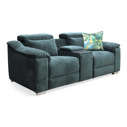Side profile of the Geneva media sofa in a reclined position, emphasizing the ergonomic support and the modern brushed-metal controls.