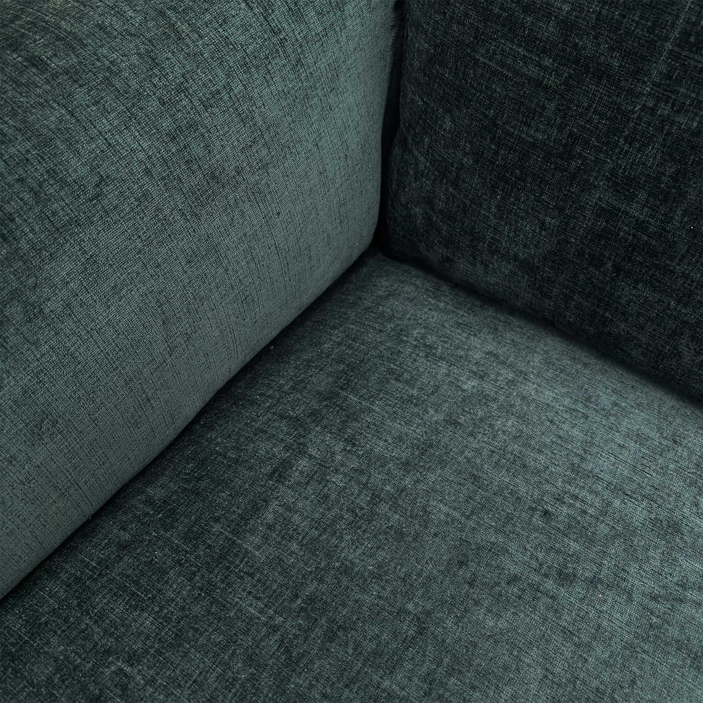 Close-up of the Forest Green linen-style fabric, highlighting the textured weave and the high-quality stitching on the armrests.