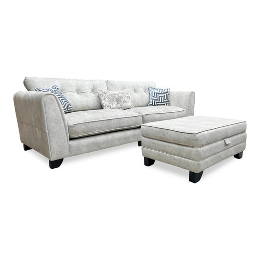 Full view of the Mariah 4-seater classic back sofa and matching storage footstool in Dapple Oyster fabric, featuring a grand silhouette with plush scatter cushions.