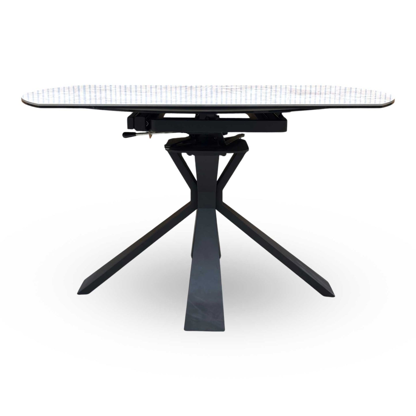 Side view of the Crete table fully extended into an oval shape, demonstrating the increased surface area perfect for hosting larger dinner parties and family gatherings.