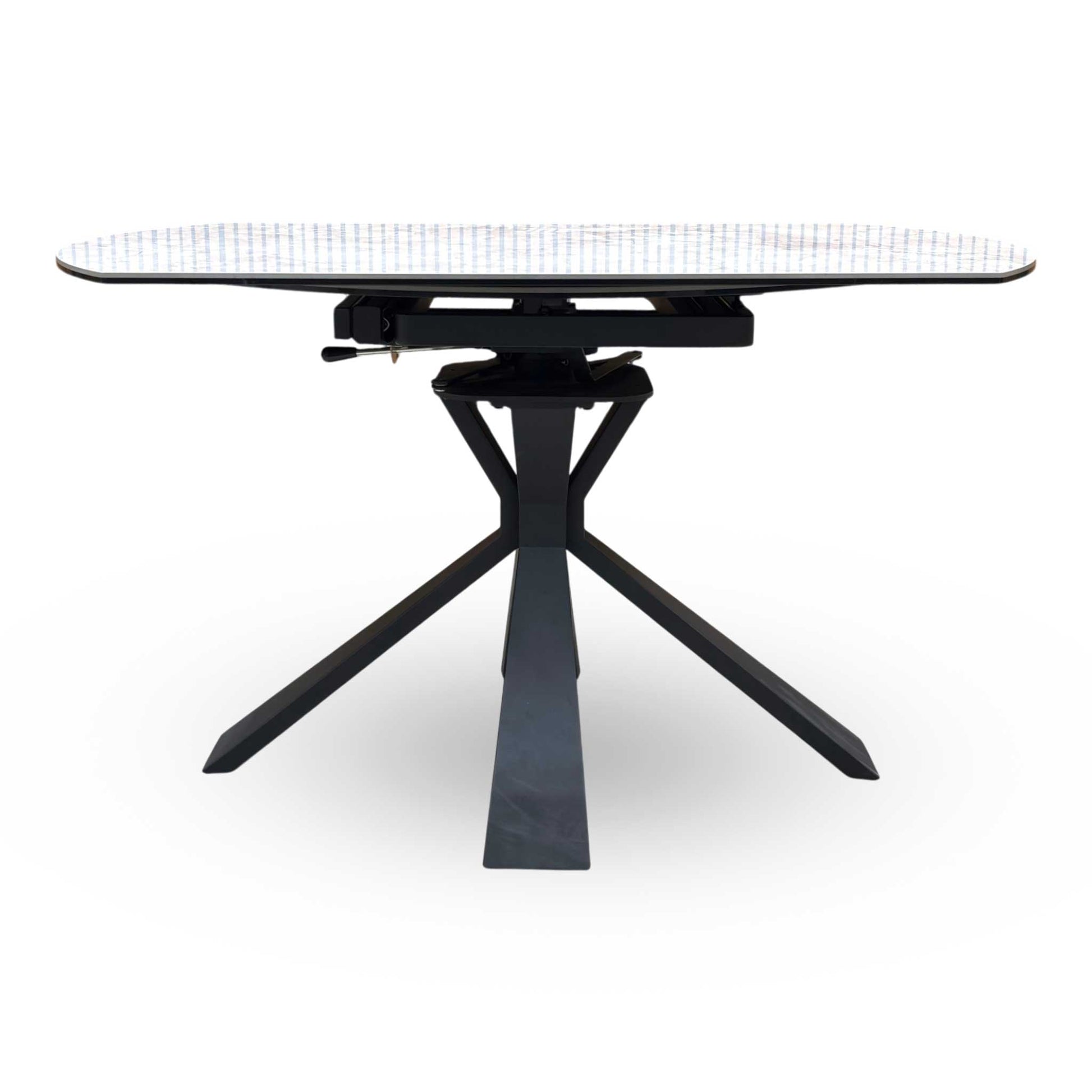 Side view of the Crete table fully extended into an oval shape, demonstrating the increased surface area perfect for hosting larger dinner parties and family gatherings.
