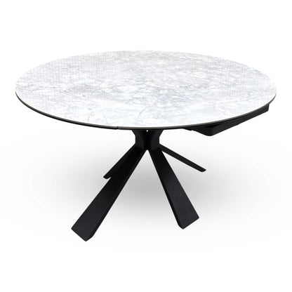 Top view of the ‘Crete’ Round Swivel Extending Table, showing the effortless rotating mechanism that reveals the extension leaves to create an oval shape.
