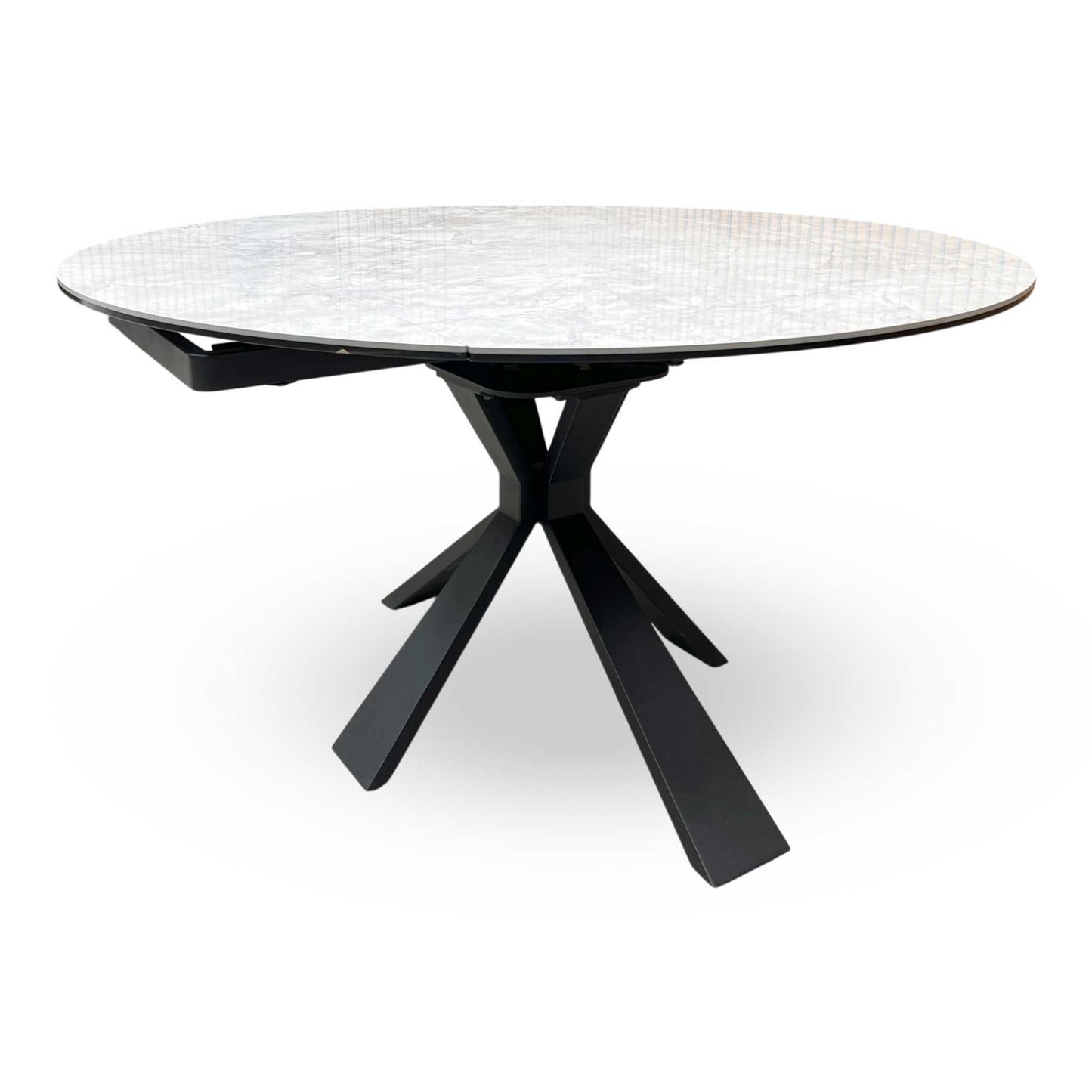 Side view of the Crete table partially extended, demonstrating the unique swivel mechanism where the leaves rotate out from beneath the main top.