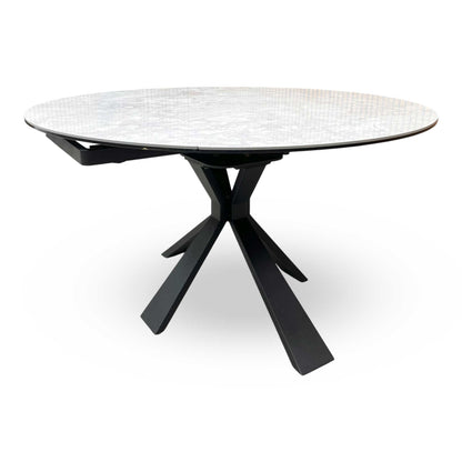 Side view of the Crete table partially extended, demonstrating the unique swivel mechanism where the leaves rotate out from beneath the main top.