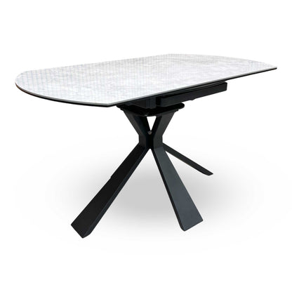 Full view of the Crete Round Swivel Extending Dining Table featuring a dark grey ceramic marble-effect top and a modern black sculptural pedestal base.