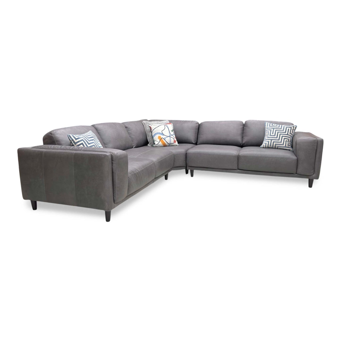 Side profile of the Brody corner sofa, emphasizing the deep seating area and the elegant angle of the back cushions for ergonomic support.