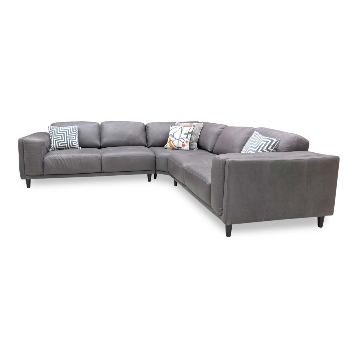 Side profile of the Brody corner sofa, emphasizing the deep seating area and the elegant angle of the back cushions for ergonomic support.