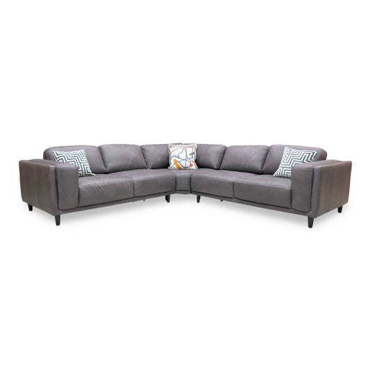 Full view of the Brody Large Corner Sofa upholstered in premium Grey Italian Leather, featuring a sleek modern design with polished chrome-finished metal feet.