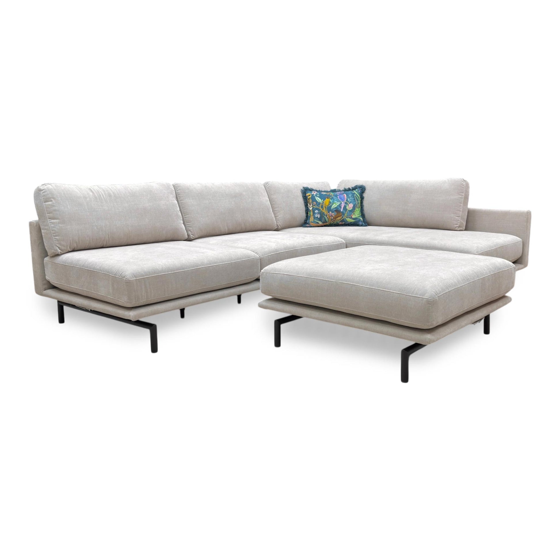 Full view of the Brixton Right-Hand Facing Corner Chaise in Taupe fabric, featuring a contemporary low-profile design and a large matching footstool.