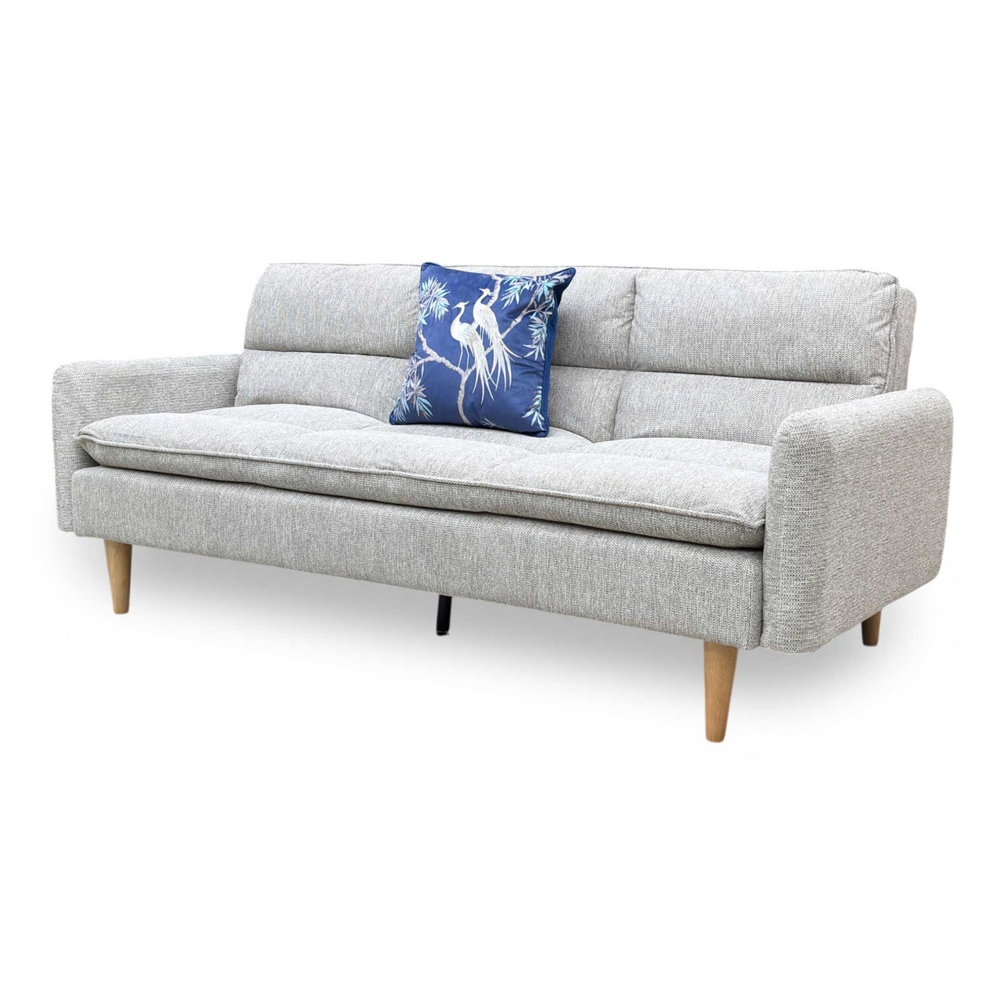 Side profile of the Chill sofa, emphasizing the sleek, low-profile design and the sturdy angle of the natural wood supporting legs.