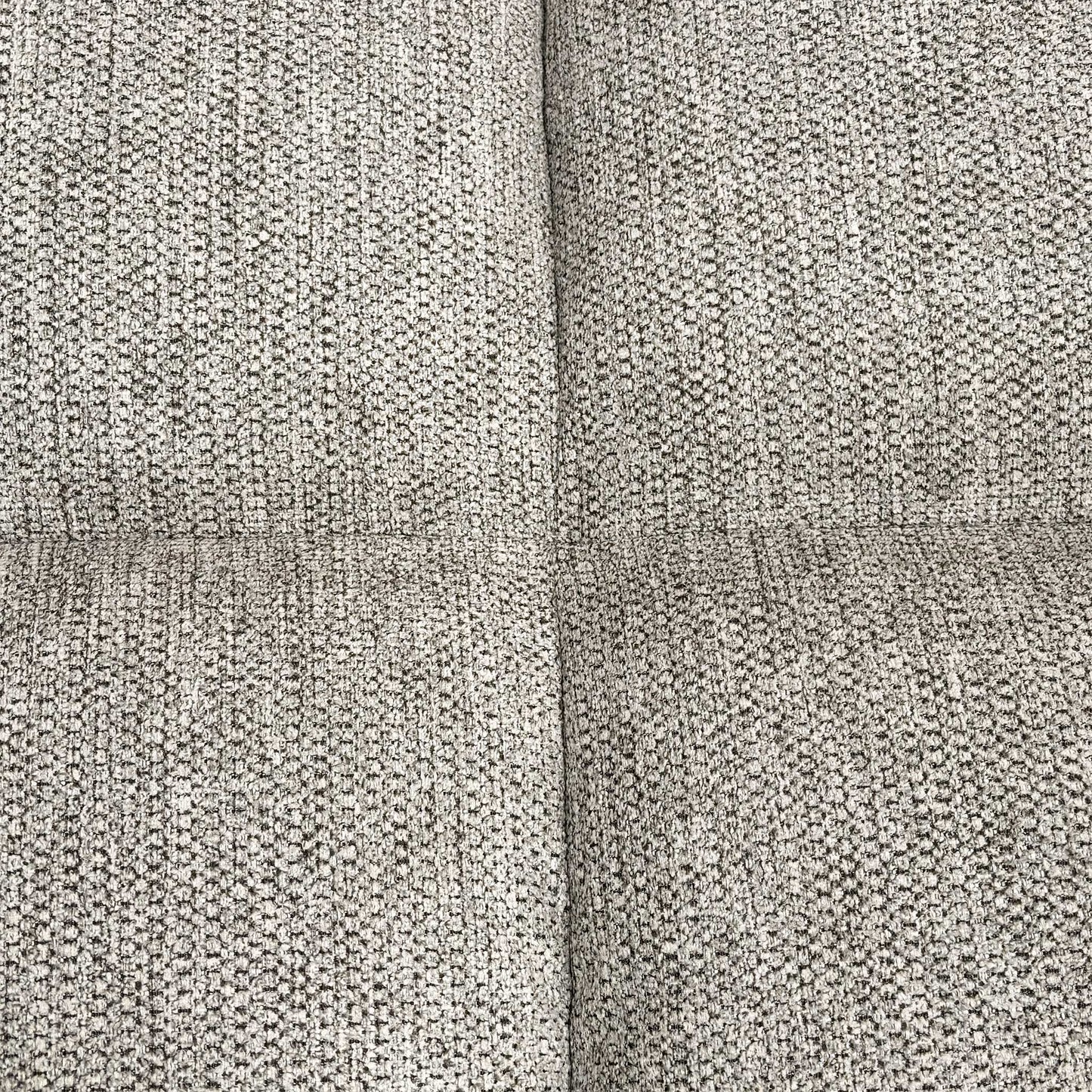 Close-up shot of the natural-toned fabric, highlighting the durable weave texture and the refined vertical channeled stitching on the backrest.