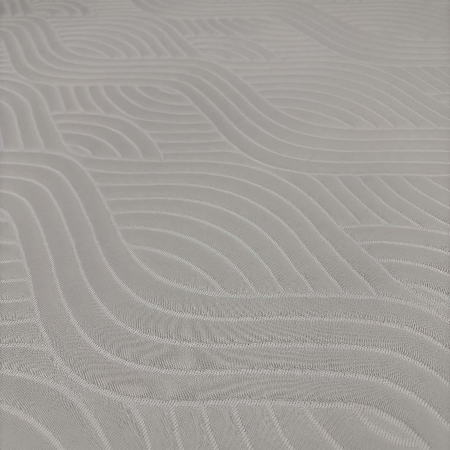 Close-up macro shot of the mattress surface, highlighting the luxurious, breathable top cover weave and cooling ventilation mesh along the sides.