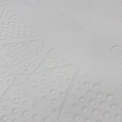 High-definition close-up macro view of the specialized temperature-regulating top cover fabric, detailing the advanced knitted cooling textile pattern and breathable mesh weave.