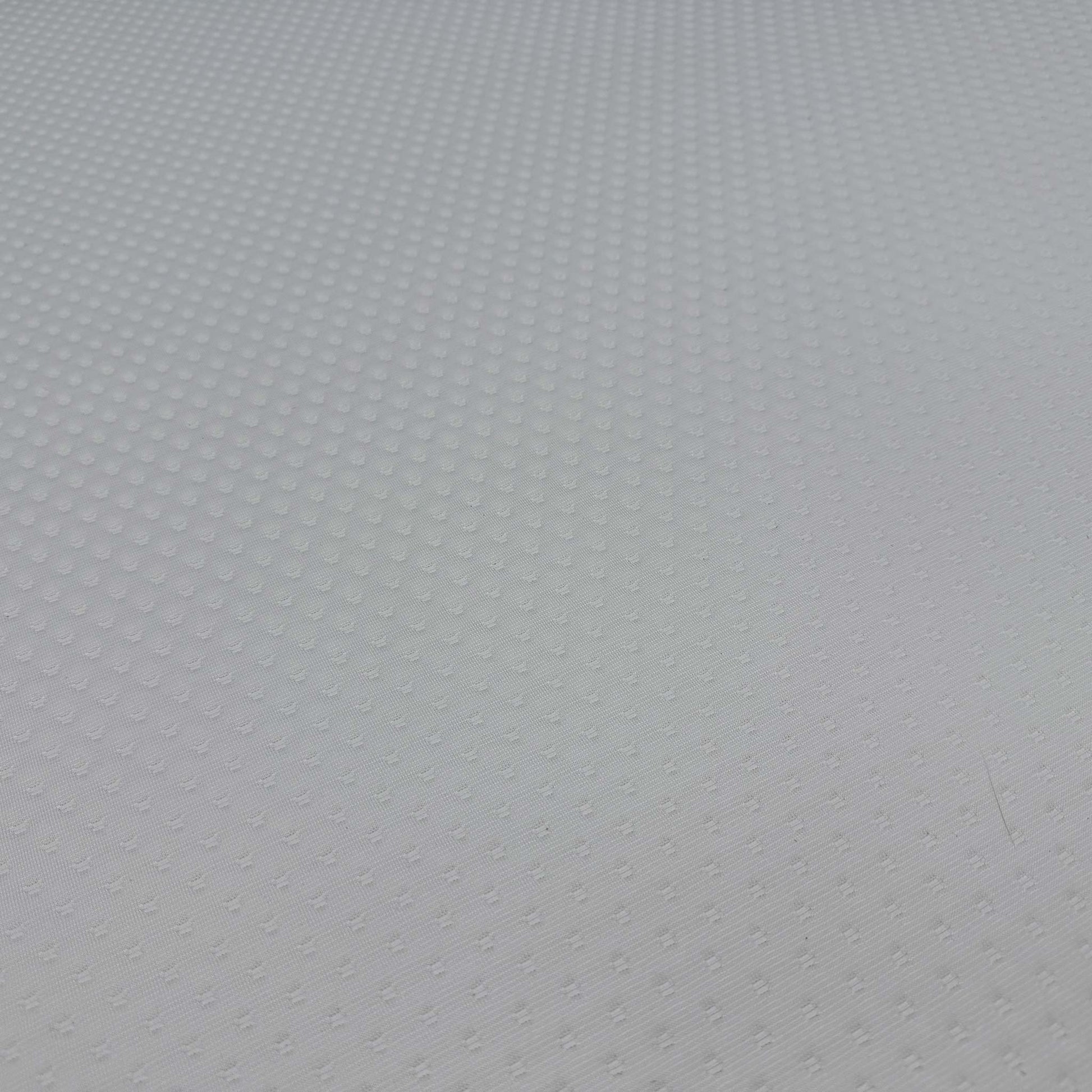 High-definition close-up macro view of the hypoallergenic temperature-regulating top cover fabric, detailing the advanced knitted textile patterns, breathable weave, and soft-touch texture.