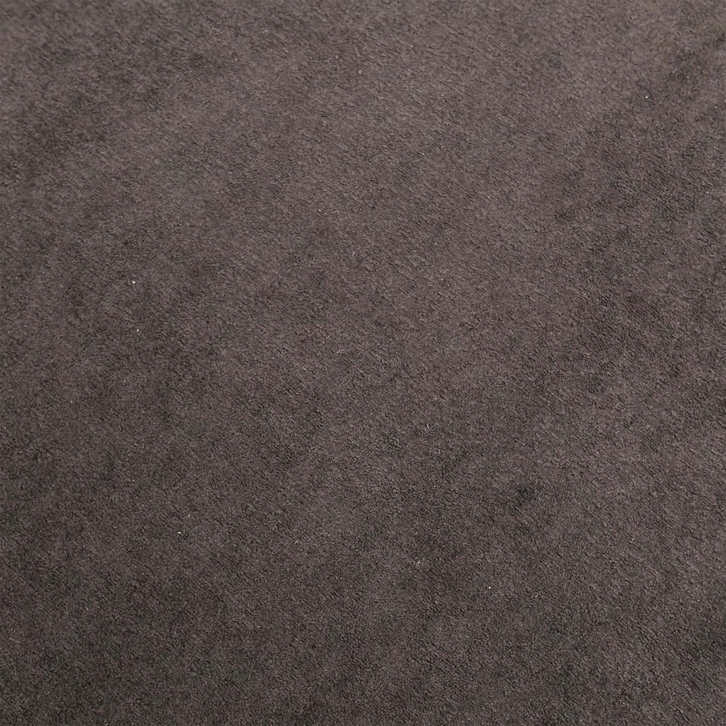 Close-up shot of the soft and durable Palmero plain fabric upholstery, detailing the subtle texture and warm brown weave fibers.