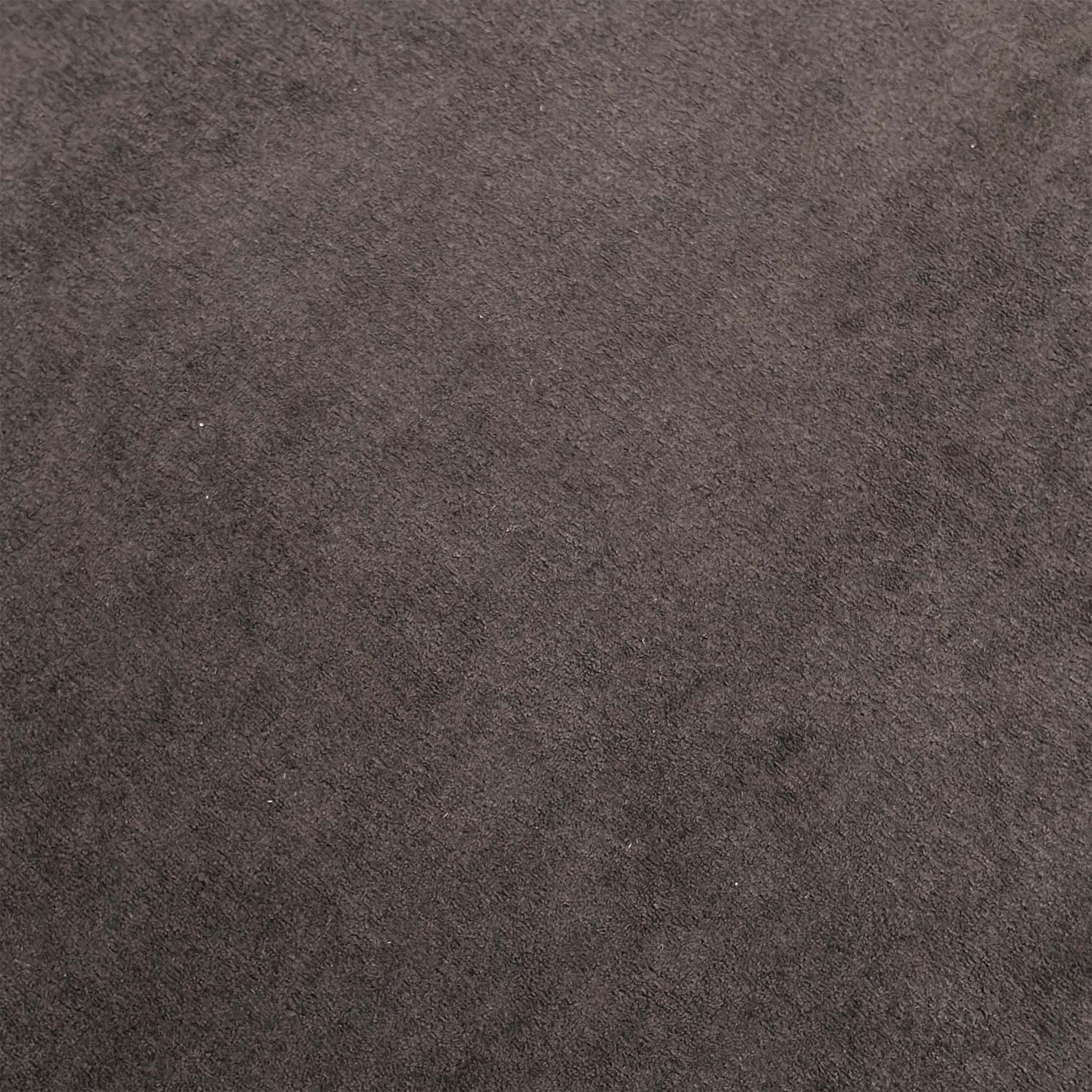 Close-up shot of the soft and durable Palmero plain fabric upholstery, detailing the subtle texture and warm brown weave fibers.