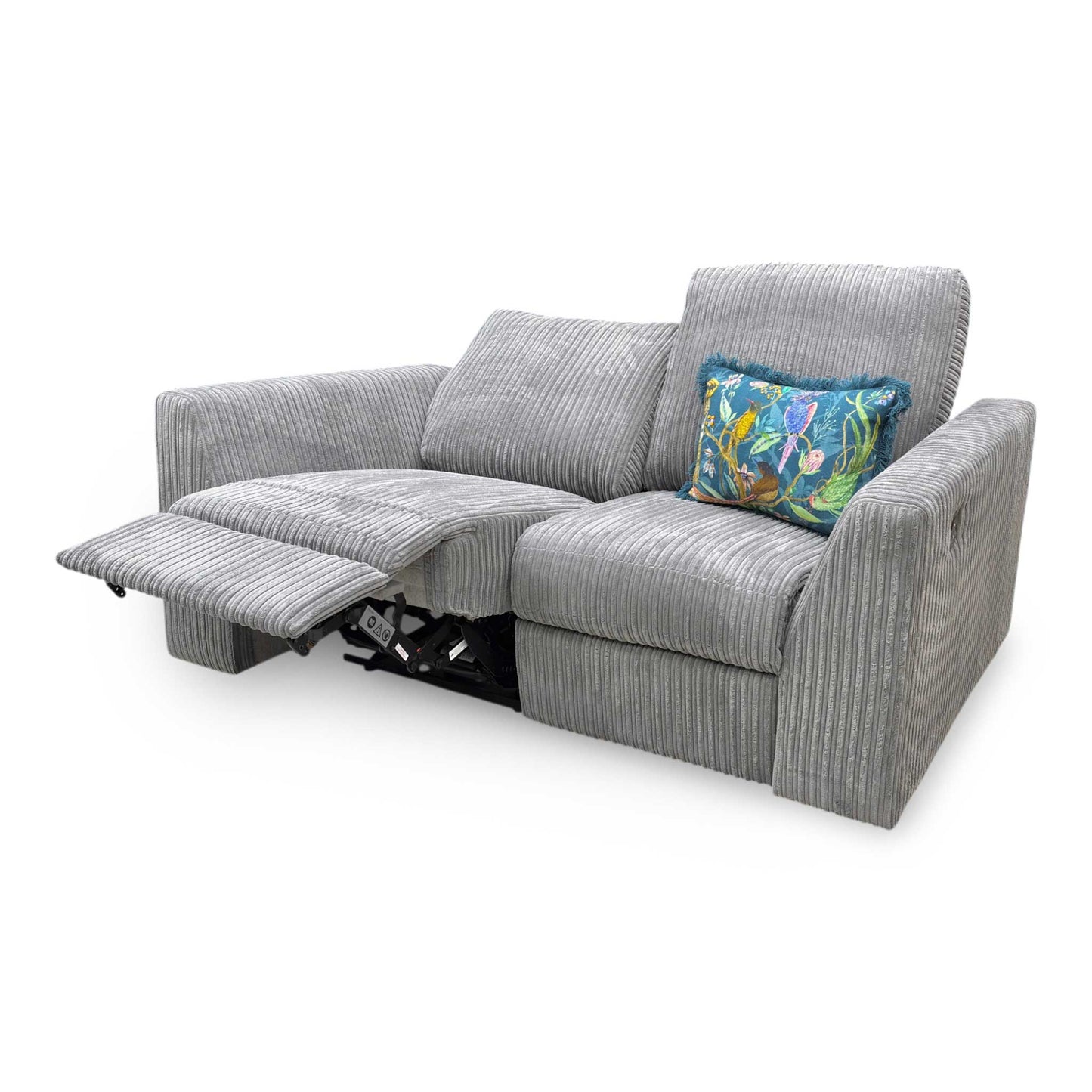 Action shot showing one of the power reclining seats fully extended, demonstrating the independent footrest extension and reclined position.