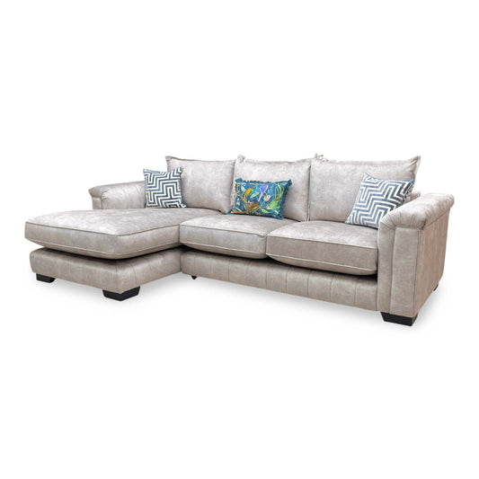 Full View DFS ‘Dolcie’ 3-seat chaise sofa, left hand facing orientation, beautifully upholstered in a soft oatmeal combination velvet with a classic structured formal backrest.