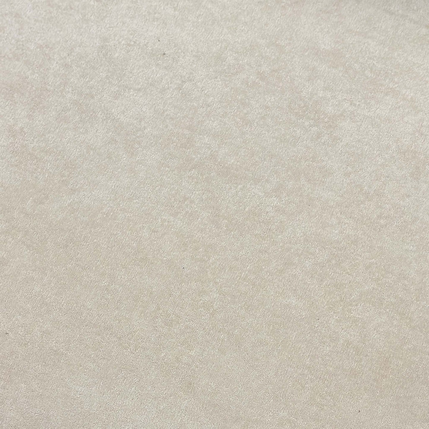 High-definition close-up macro view of the cream Palmero velvet fabric, showcasing the fine weave, clean texture, and rich luxury finish.