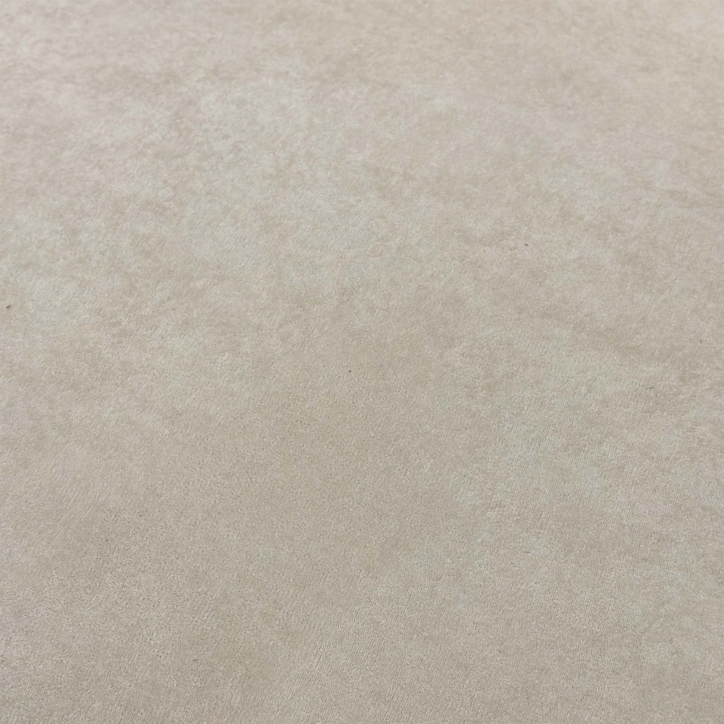 High-definition close-up macro view of the cream Palmero plain velvet textile, showing its smooth low-pile sheen and delicate neutral color tones.