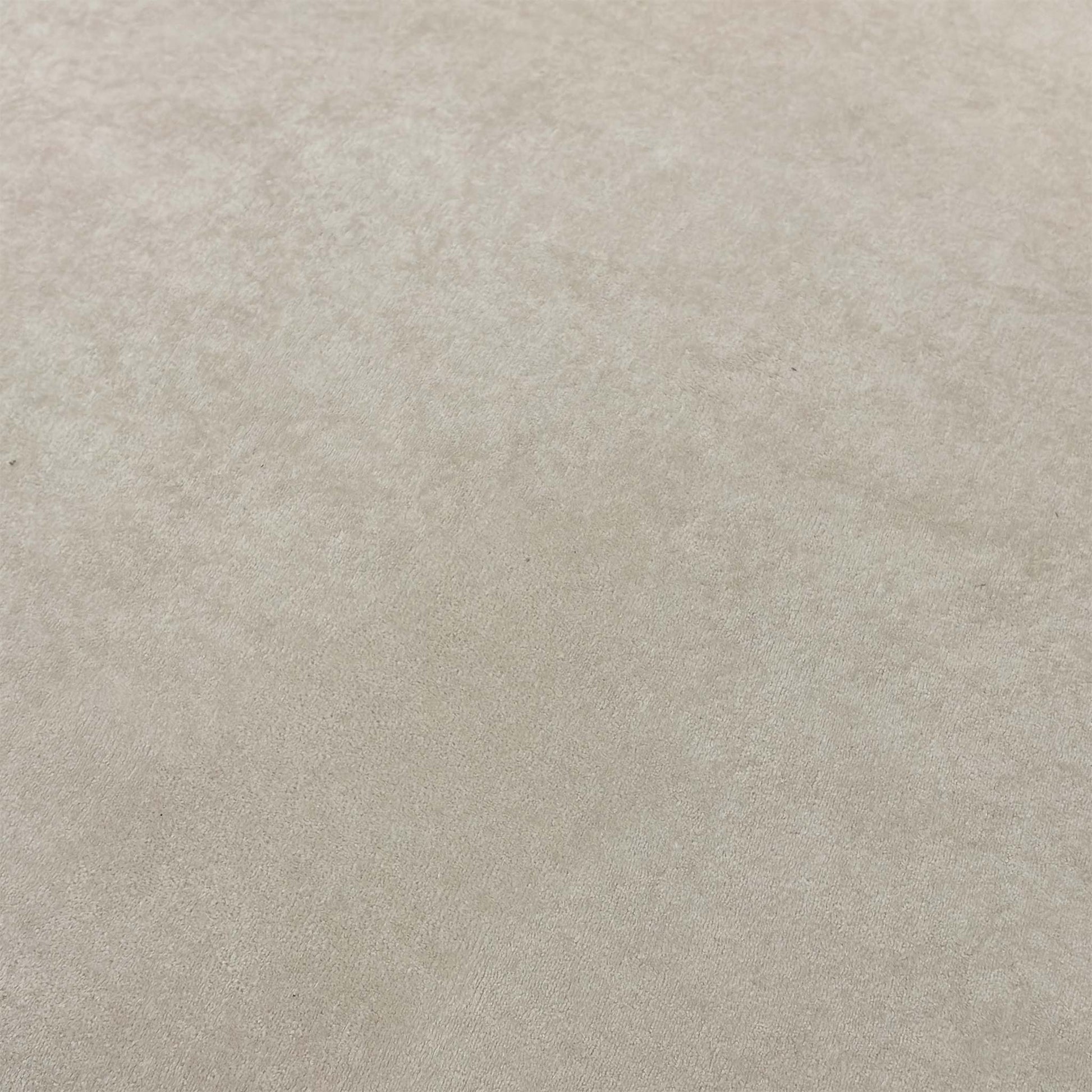 High-definition close-up macro view of the cream Palmero plain velvet textile, showing its smooth low-pile sheen and delicate neutral color tones.