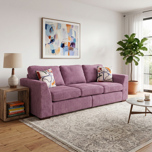 Living Room VIew DFS ‘Heydon’ large 4-seater sofa, fully upholstered in soft, textured lilac purple Marley jumbo cord fabric, showcasing its expansive, comfortable design.