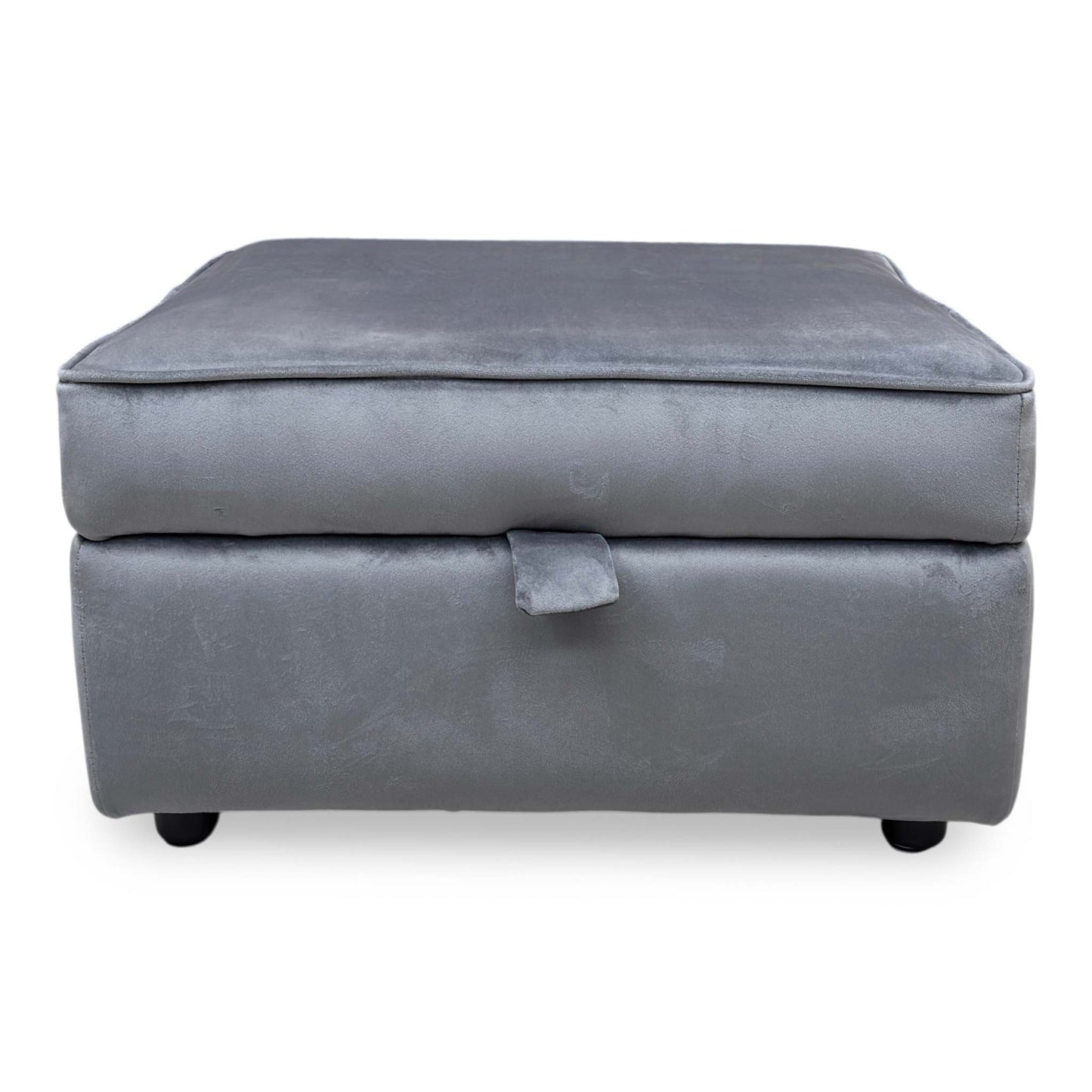 Top-down view of the Felix ottoman lid, emphasizing the soft Steel Grey velvet finish and neat piping details around the edge.